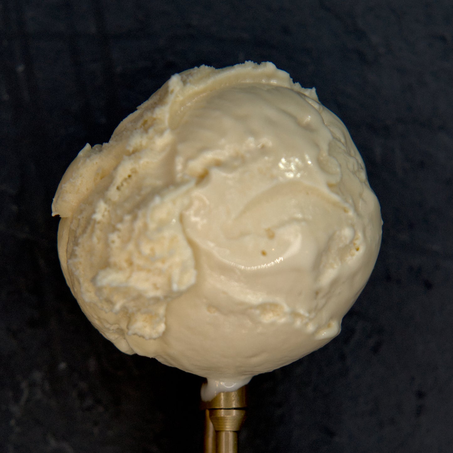 Ice cream scoop on a black background